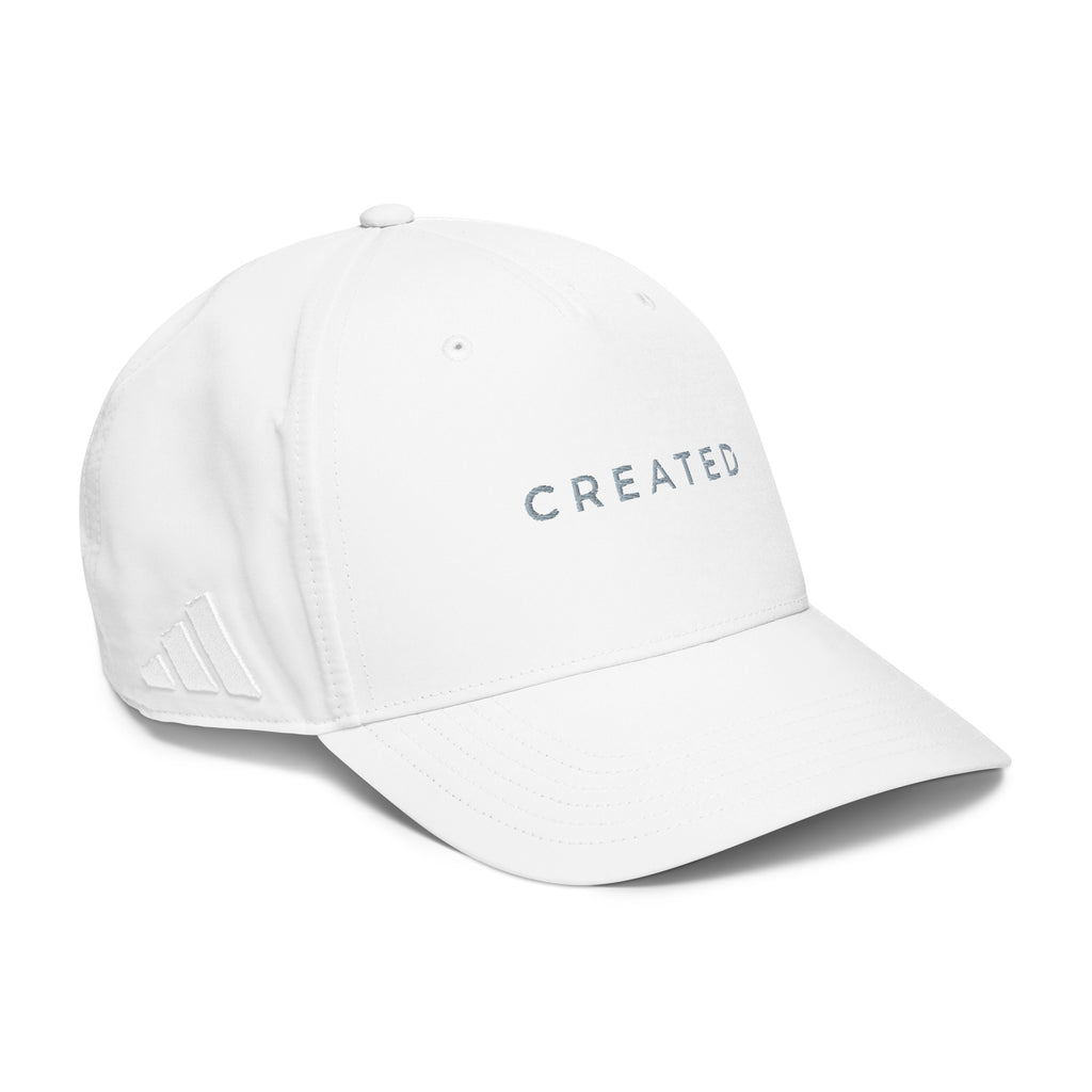 White cap with 'CREATED' text on a white background.