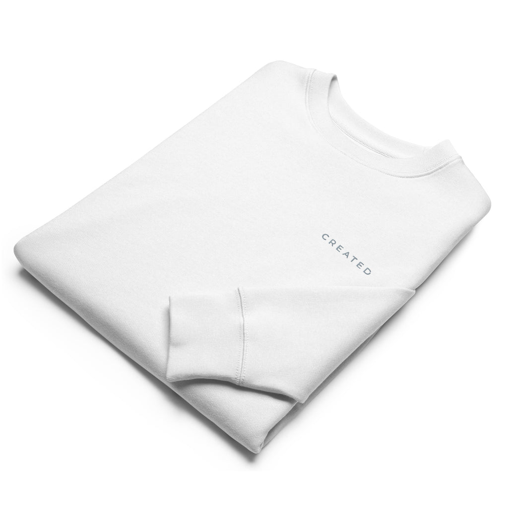 Detail of white sweatshirt on a white background.